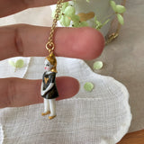 Tiny porcelain doll necklace - black dress .. Collier mini poupée  en porcelaine - petiterobenoire